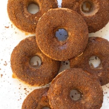 doughnuts stacked with a cinnamon sugar glaze