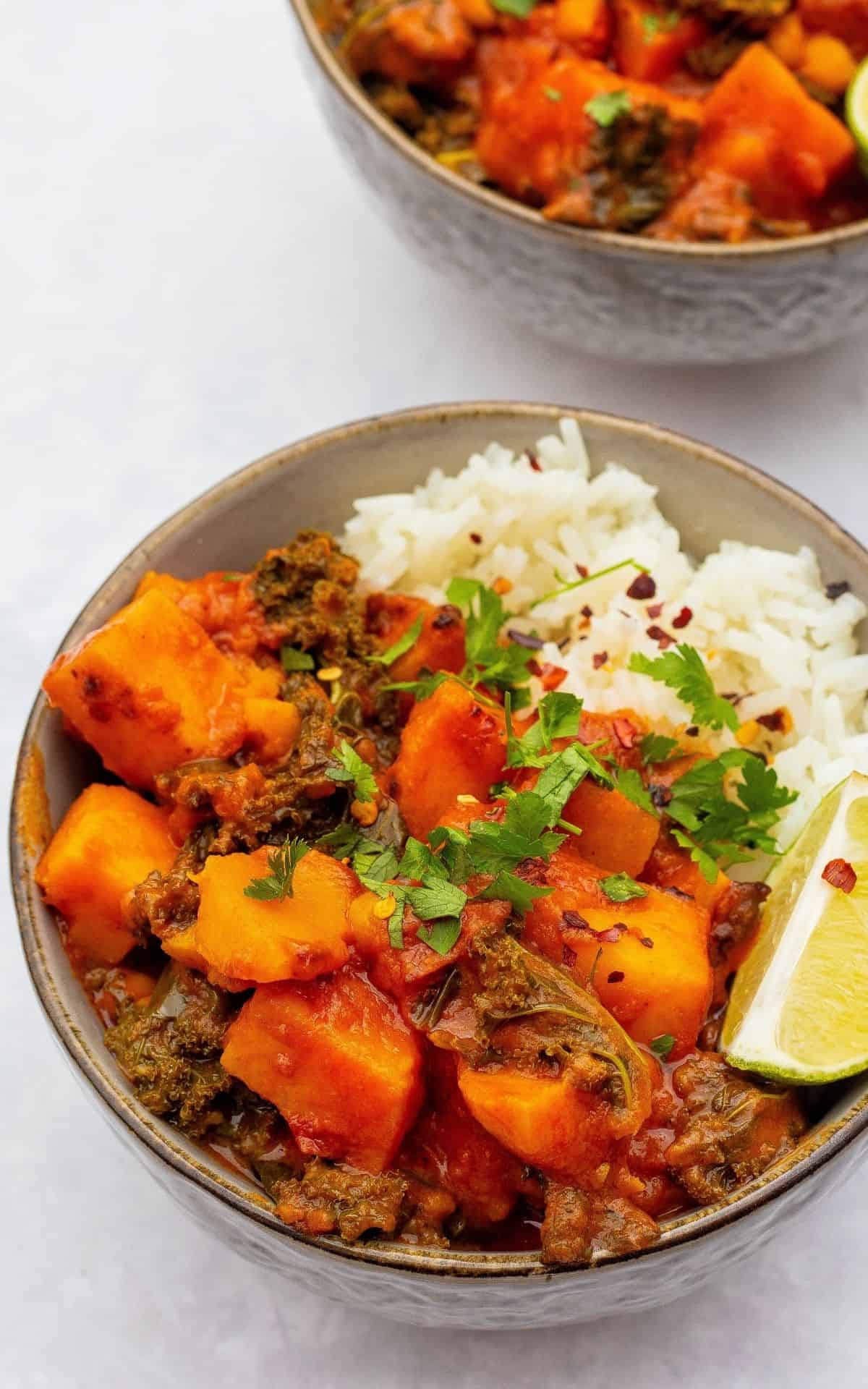 sweet potato & chickpea curry with white rice served in bowls