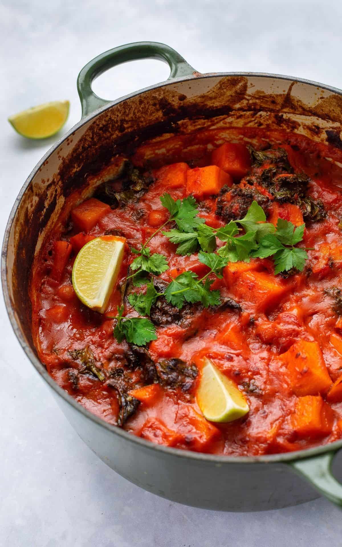 Sweet Potato & Chickpea Curry cooked in a large cast iron pot