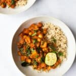 Butternut Squash and Chickpea curry in a bowl with lime