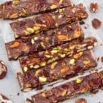 Vegan rocky road in slices on parchment paper.