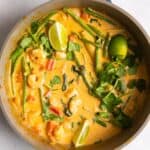 overhead shot of Thai red prawn curry in large shallow frying pan.