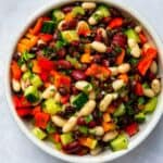 mixed bean salad in large bowl on white surface