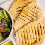 3 gluten free flatbreads on white plate.