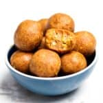 peanut butter balls served in a bowl.