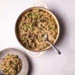 Vegan Mushroom Risotto served on a plate and in a serving dish.
