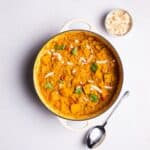 Coconut Dhal served with fresh coriander and coconut flakes.