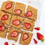 Peanut Butter Blondies with strawberries on top.