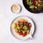 Broccoli Stir Fry served on a plate with brown rice.