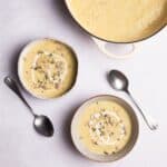 Parsnip soup with sunflower seeds served in bowls.