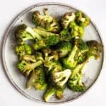 Air Fryer Broccoli on a grey plate.