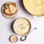 celeriac soup with cream and hazelnuts on top.