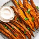 air fryer sweet potato wedges served with a dip.