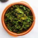 air fryer kale chips in a bowl.