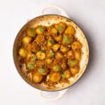 Bombay Aloo (bombay potatoes) garnished with fresh corriander.