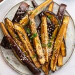 Air Fryer Aubergine sprinkled with sesame seeds.