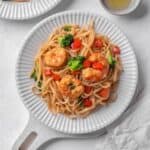 prawn noodles with broccoli and red pepper.