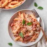 sausage pasta with tomatoes and parmesan.