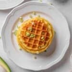 potato waffles served on a plate.