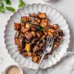 roasted aubergine served on a plate.