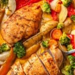 Chicken and vegetables in a baking tray.