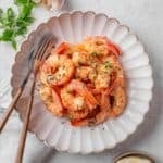 Garlic prawns served on a plate.