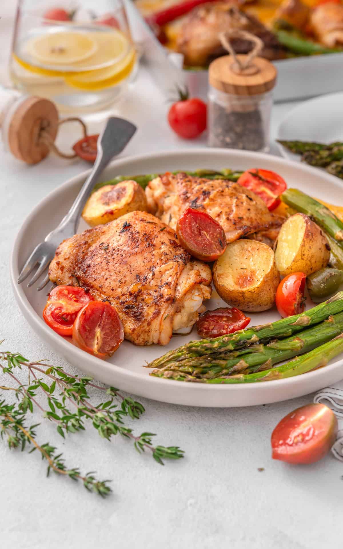 Chicken and vegetables served on a plate.