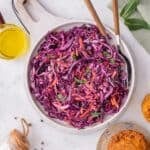 Red cabbage slaw salad served on a plate.