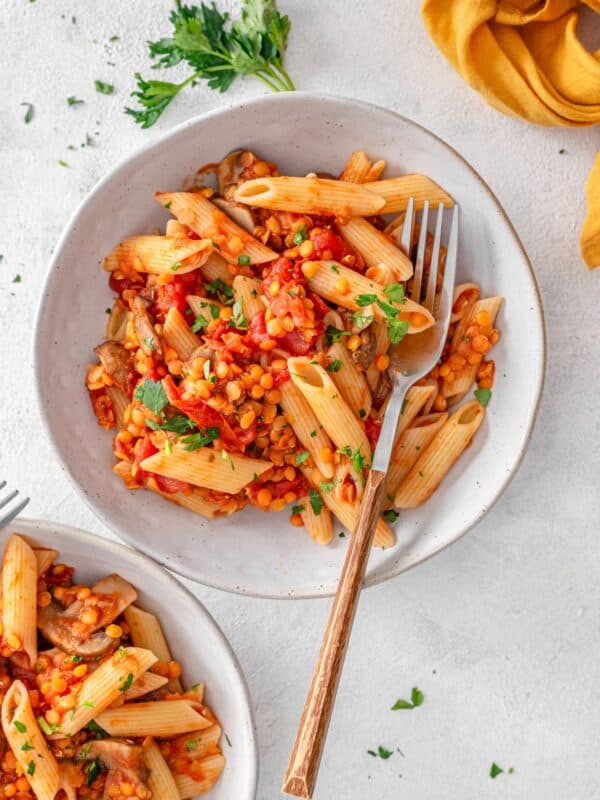 Mushroom & Lentil Ragu served on a plate with fresh parsley.
