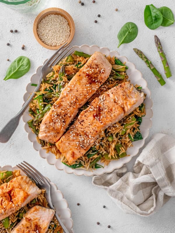 Honey and soy salmon served over sesame spinach rice with asparagus