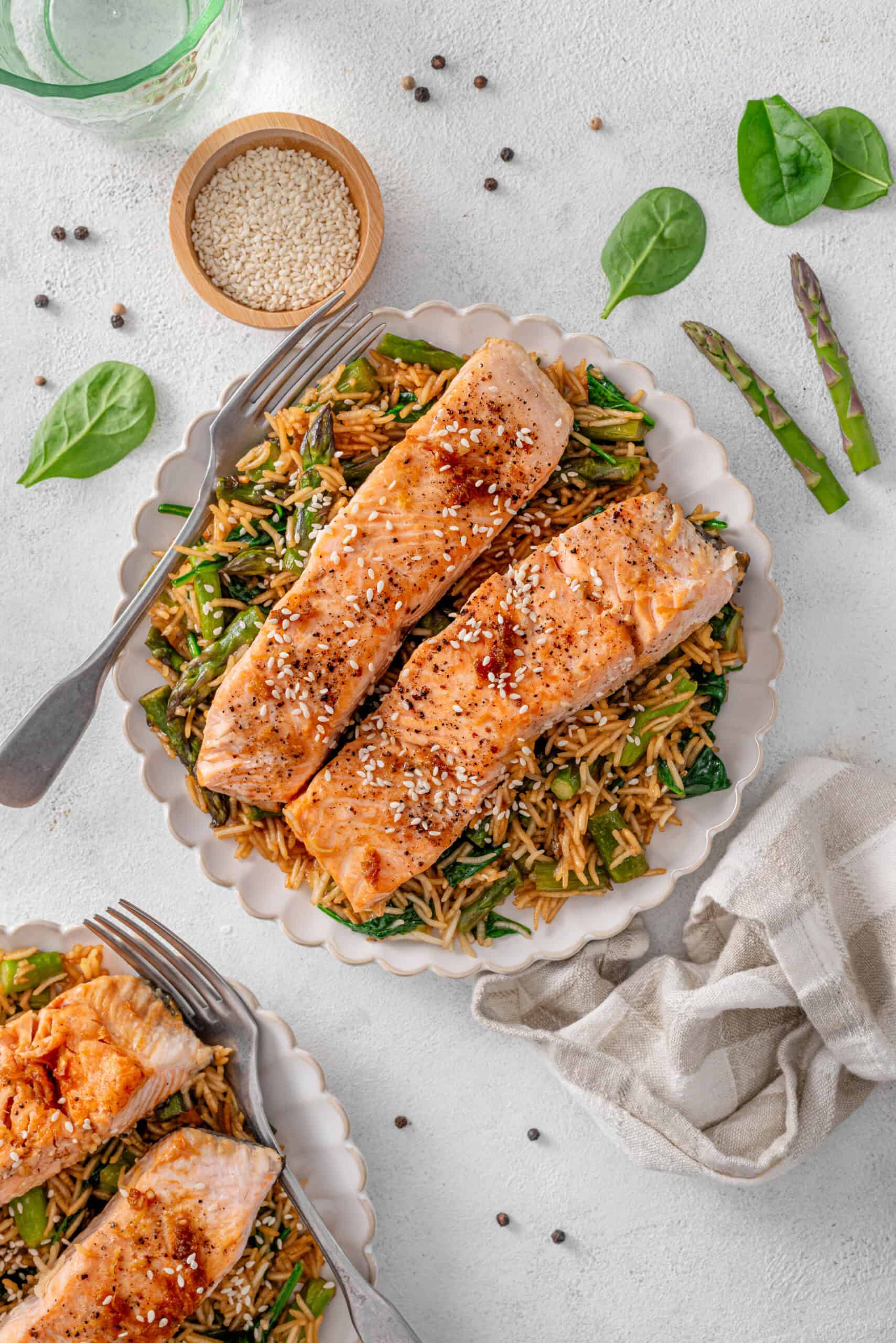 Honey and soy salmon served over sesame spinach rice with asparagus