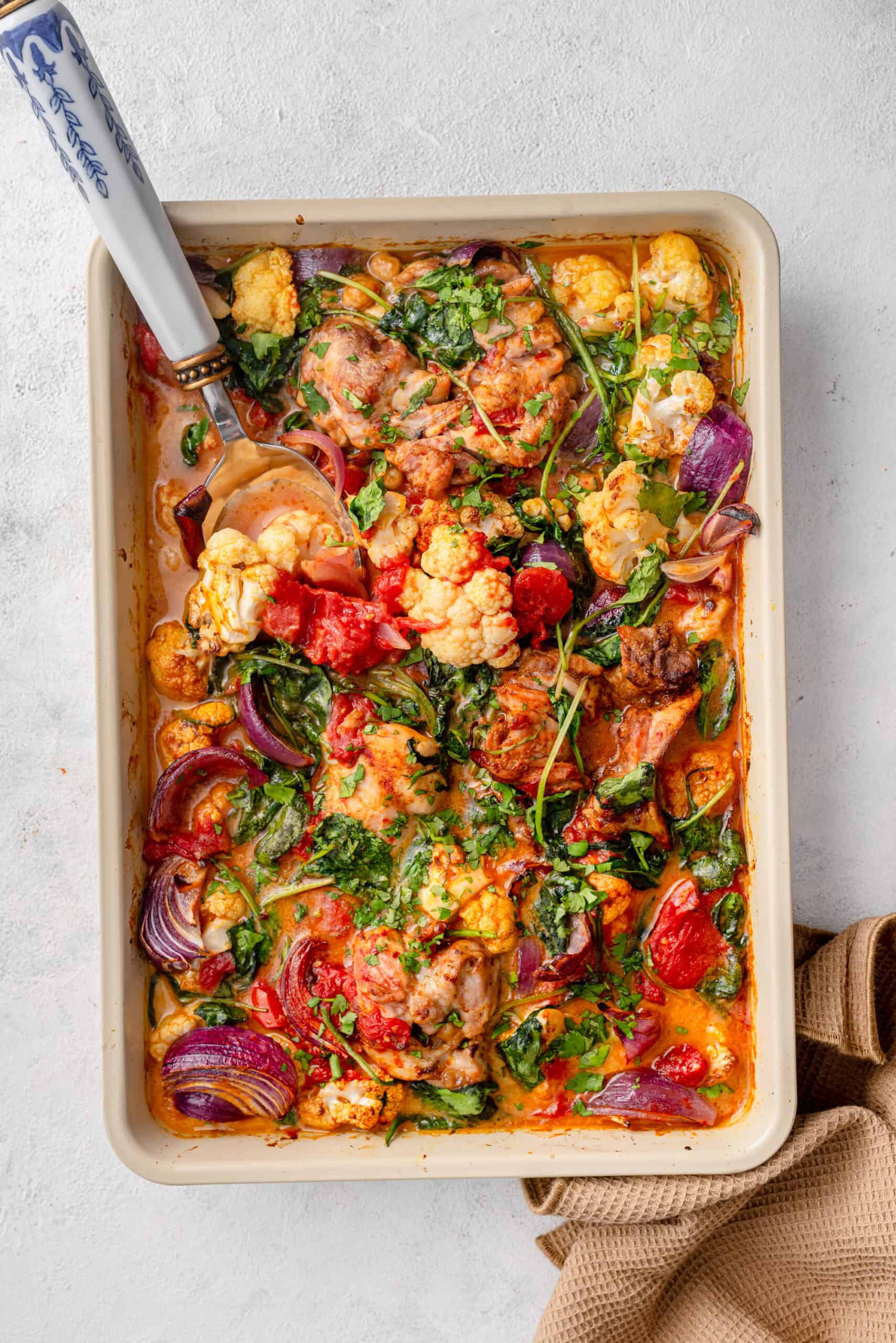 One-pan mild chicken curry traybake with cauliflower and chickpeas